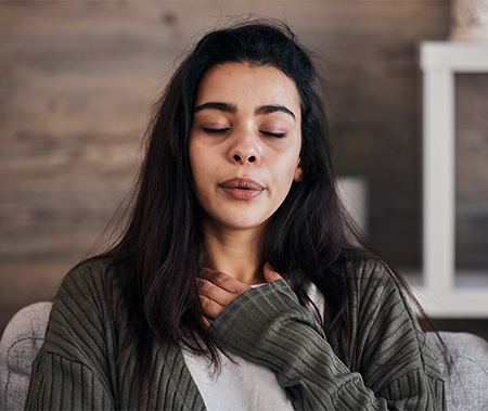 A person with closed eyes during a mindfulness exercise